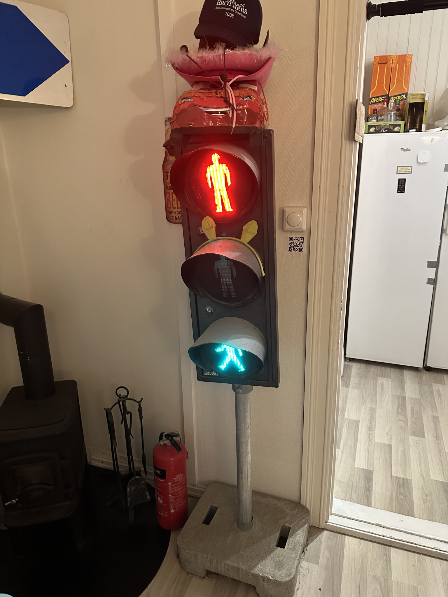 The physical traffic light with the top red lamp and the bottom green lamp lit at the same time.